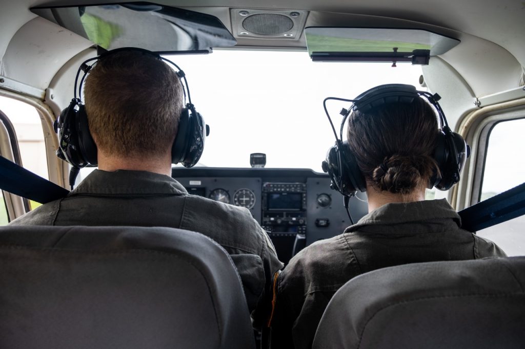 Two JROTC Aviation Students flying an airplane