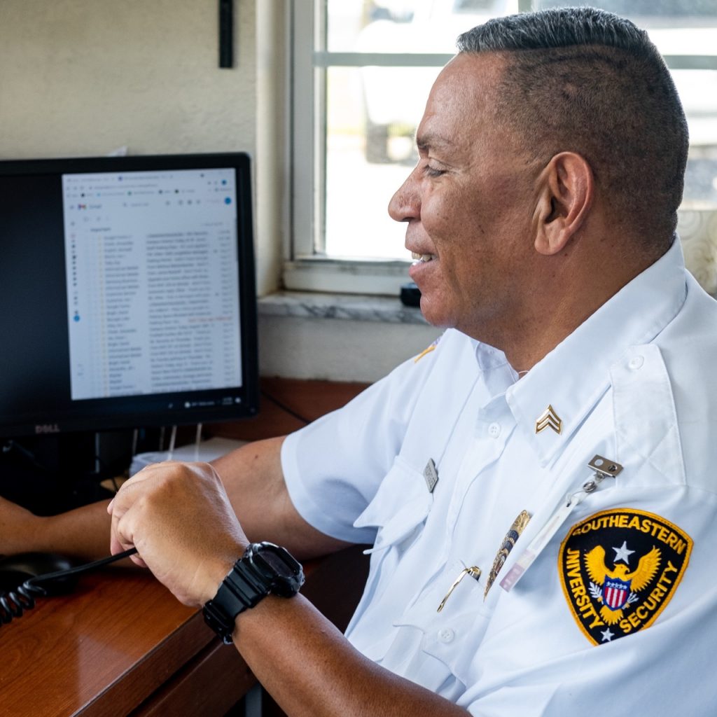 Security officer sitting at a desk