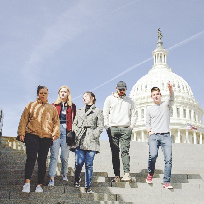 Political science students walking in front of the Capitol Building in Washington D.C.