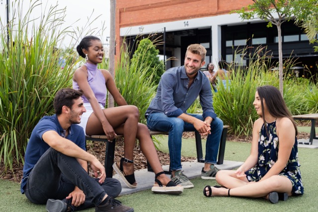 Students sitting outside at a Tampa food hall 