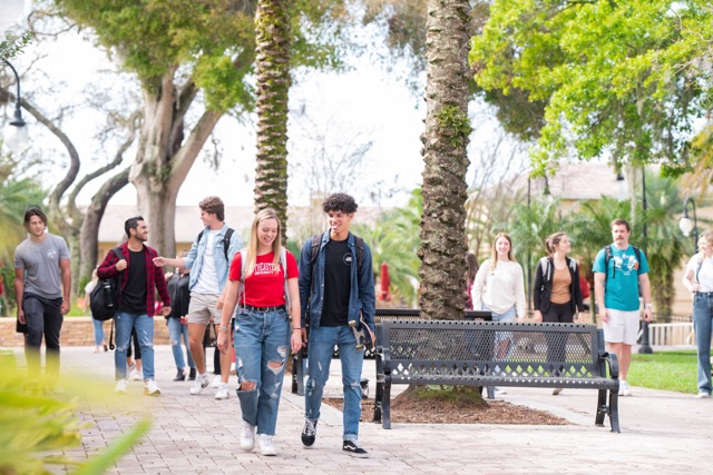 Group of Students walking and talking on campus