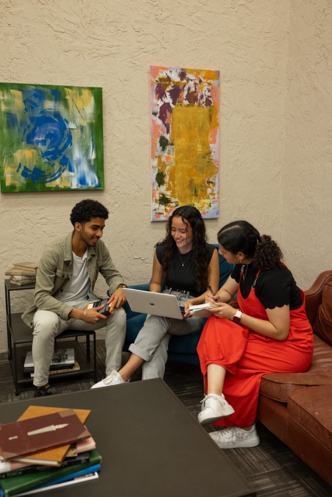 Group of students sitting on couches together studying