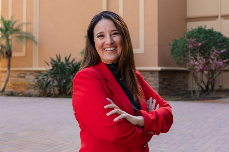 Dr. Lisa Coscia, SEU Dean of College of Education standing