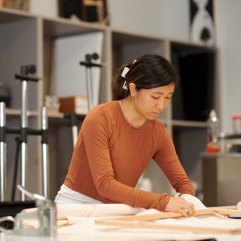 female student working in art class