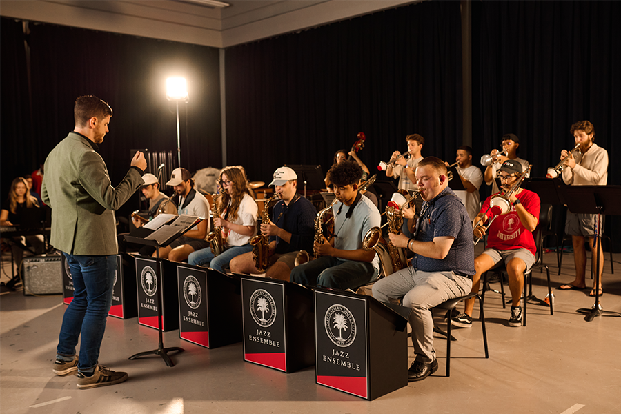School of Music students playing instruments in front of instructor.