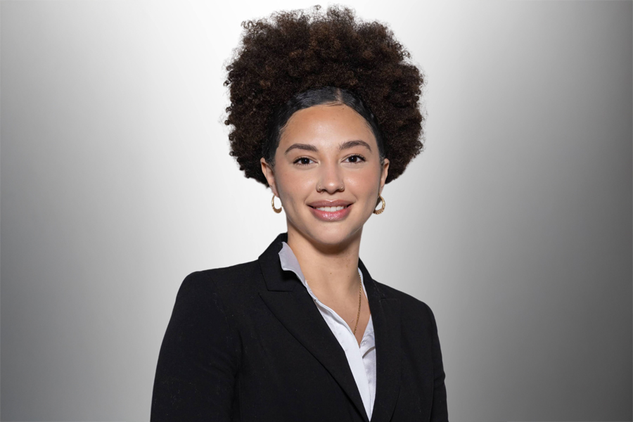 Photo of SEU Alumna Nathalie Rincon. She is wearing a business suit and smiling.