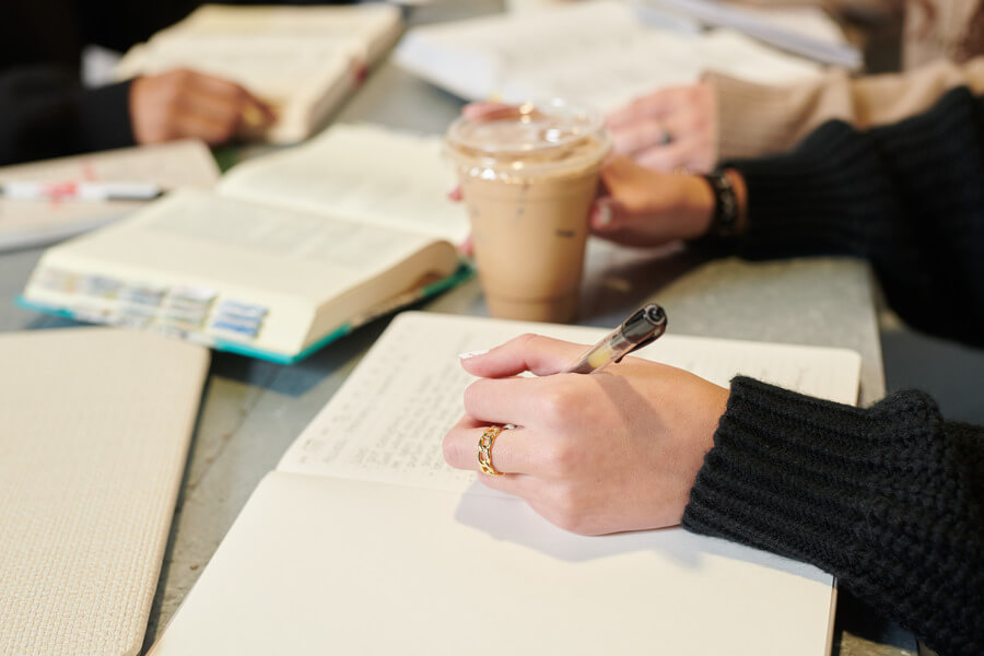 Students studying the Bible with coffee