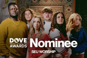 SEU Worship standing with text in front of them saying "Dove Awards Nominee"