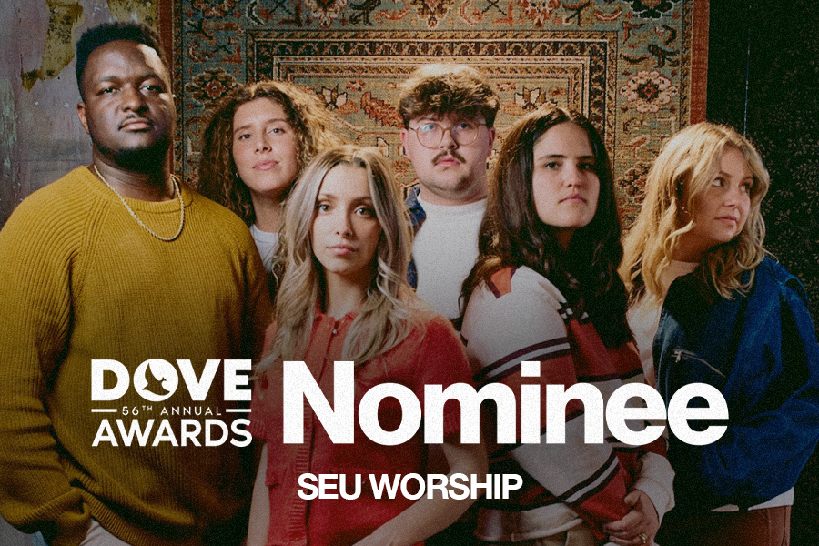 SEU Worship standing with text in front of them saying "Dove Awards Nominee"