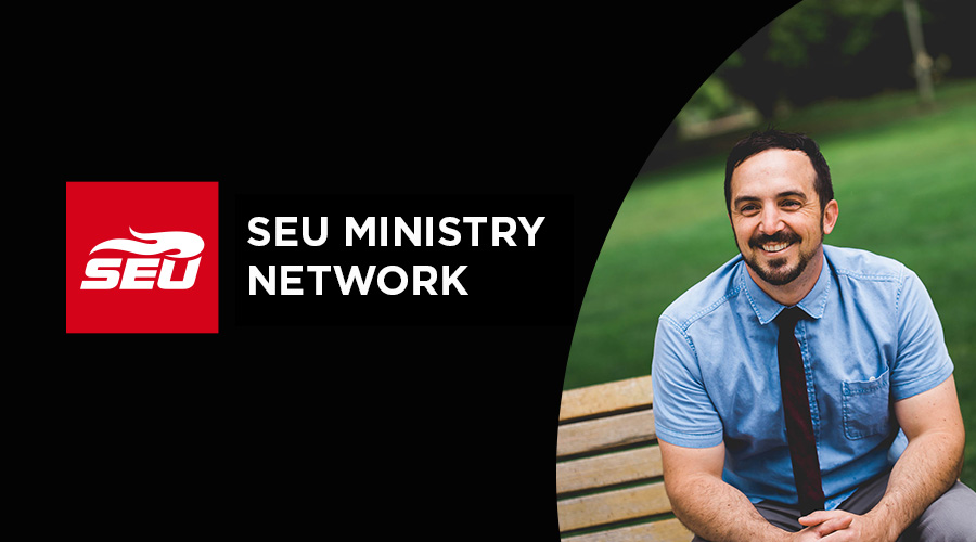 Man in blue shirt with black tie smiling next to SEU Ministry network logo